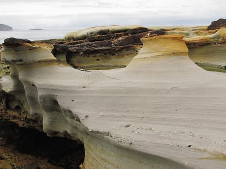closeup of a weathered sandstone structure at the coast of australia