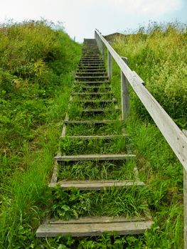 wooden stairs reaching into the sky