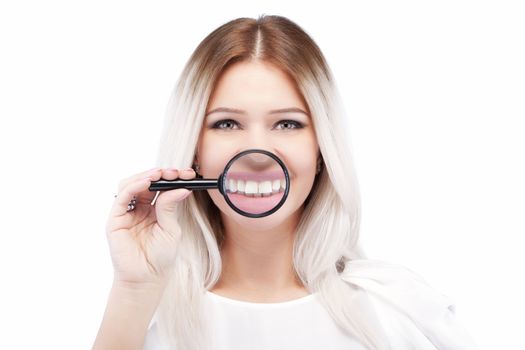 attractive caucasian girl with loupe on her shiny white teeth