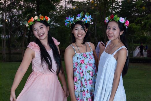 Asian Thai Girls with Flower Crown in the Park