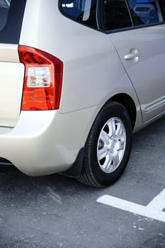 grey metallic modern passenger car on parking