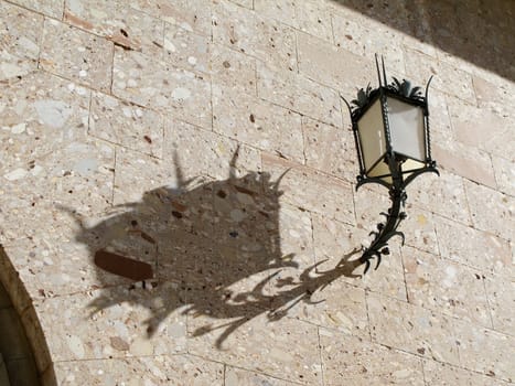 lantern and its shadow on a wall, interesting structure