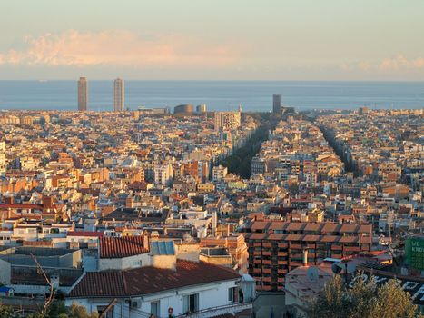 Barcelona in warm sunlight seen towards the sea