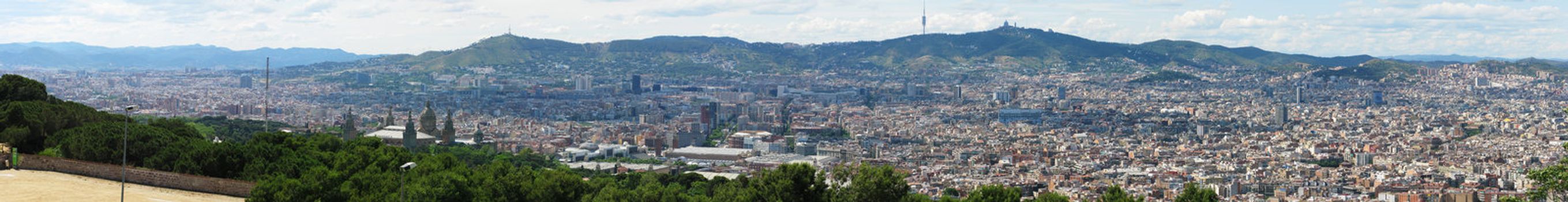 Panorama view of Barcelona from montjuic with mountains in the background