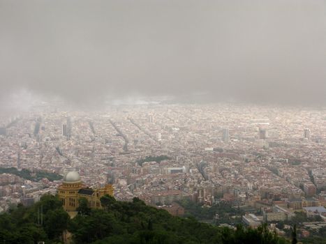 Panoramic view of Barcelona under grey rain clouds