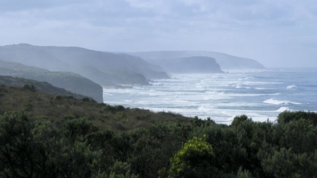 view towards cliffs in fog at the great ocean road, victoria, australia