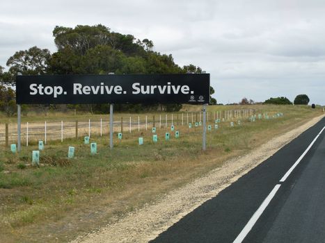 stop revive survive sign on a road in australia