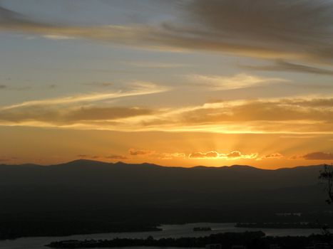 sunset with mountains and river in canberra, australia