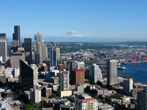 view of the seattle skyline with skyscrapers and mount rainier