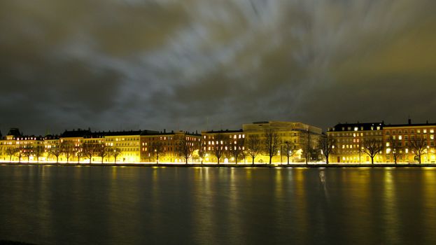View of the city of Copenhagen along the lakes at night with moon light.