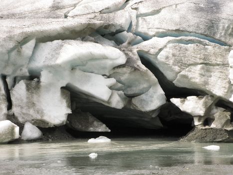 mouth of a glacier in the alps, the place where water comes out of the glacier