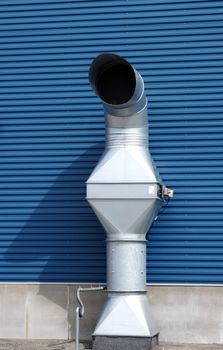 The greater pipe of ventilation is near a building