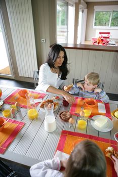 Family eating breakfast together