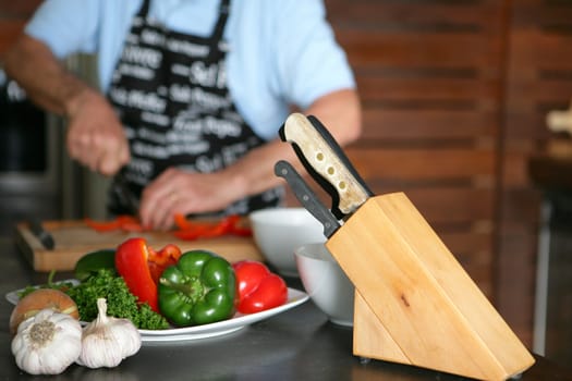 man cutting vegetables