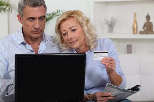 senior couple shopping on the Internet