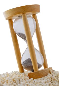 Wooden Hourglass with black sand over white sand