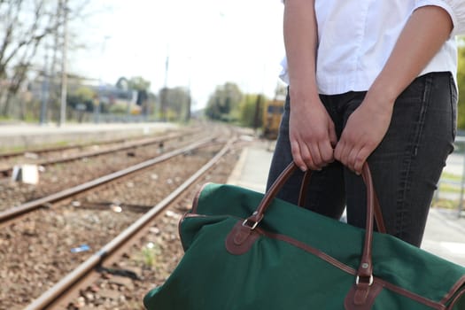 Woman waiting on outdoor platform