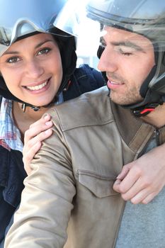 Smiling couple having a bike ride