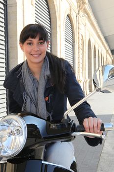Young woman on a scooter