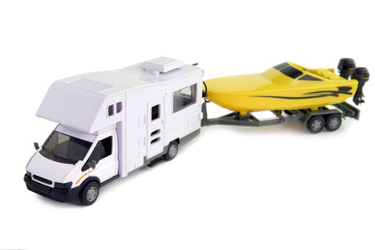 Camping vehicle pulling speed boat on trailer