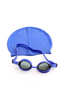 Blue swimming cap and goggles