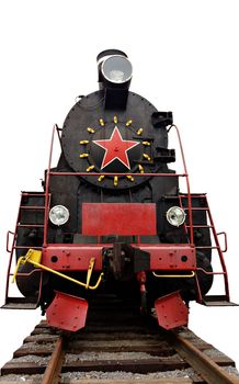 The Soviet steam locomotive on rails in a museum. Isolated Over White