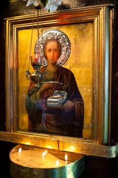 Holy apostle with picture frame in a church