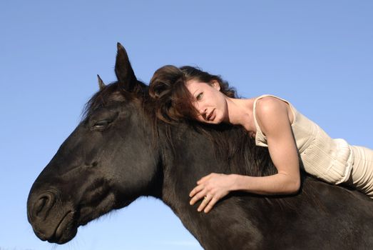 young woman and her best friend black stallion