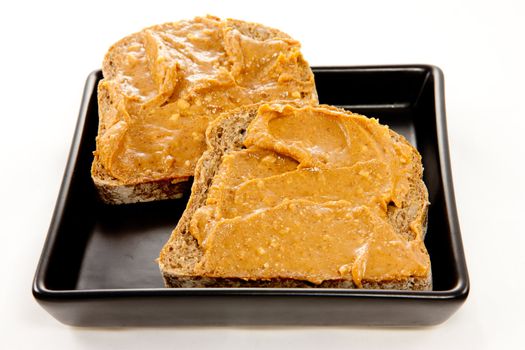 Picture of two slices of bread with peanut butter