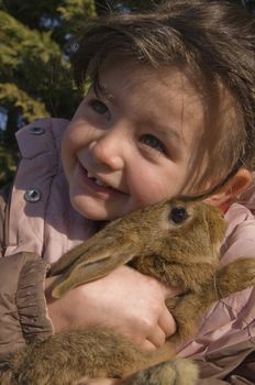 little girl and her best friend young bunny