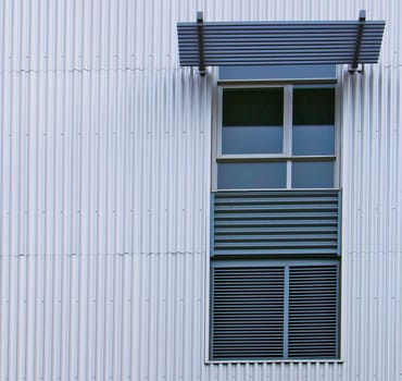 Modern widows on a steel or aluminum Corrugated sheet wall