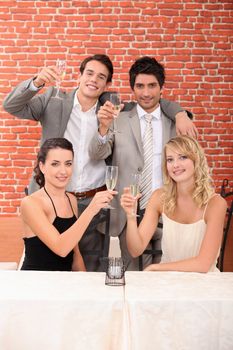 Couples celebrating in a restaurant