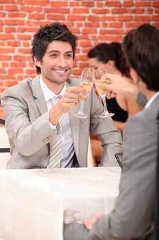 Men drinking champagne