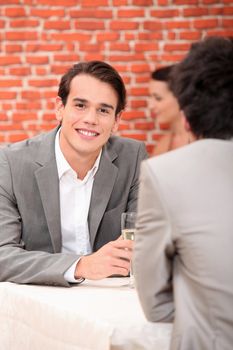 Young men in a winebar