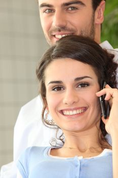 Man and girl making a call