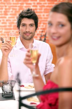 Couple in a restaurant with champagne