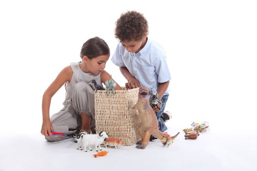 Young children playing with toys