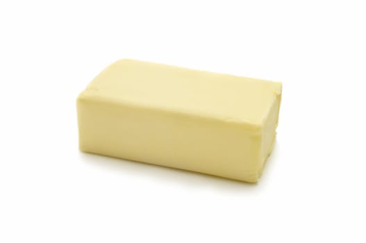 Piece of butter on white background