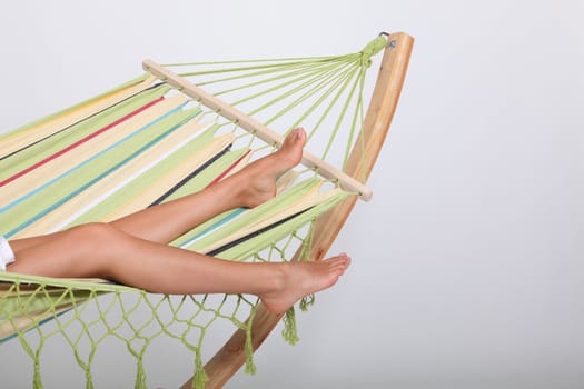 Woman laying in hammock