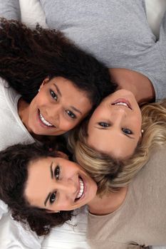 Three female faces seen from above