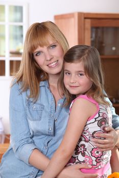 Woman hugging her daughter