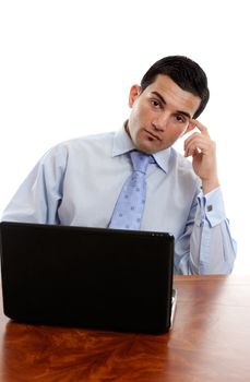 A businessman sitting at office desk and thinking