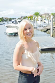 Attractive blond lady at the boat marina