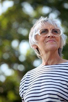 senior woman walking in the park