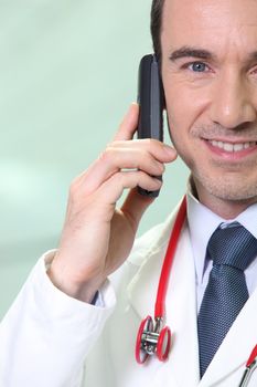 Doctor giving good news over the telephone