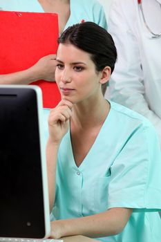 Nurse sitting at a computer