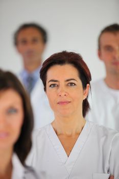 Nurse standing with colleagues