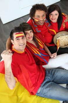 Four Spanish soccer fans waiting for the match to start