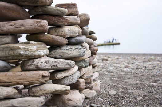 Philosofy nature stone on sea shore closeup