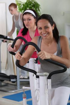 female using an exercise machine in the gym